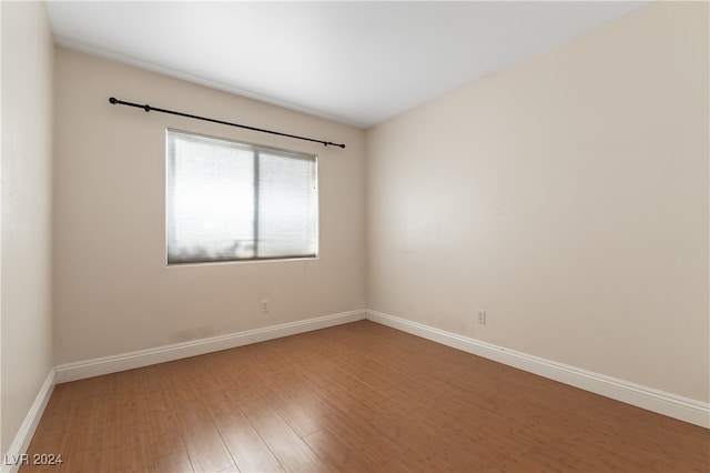 empty room featuring wood-type flooring