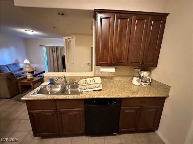 kitchen featuring dishwasher, light tile patterned flooring, dark brown cabinetry, and sink