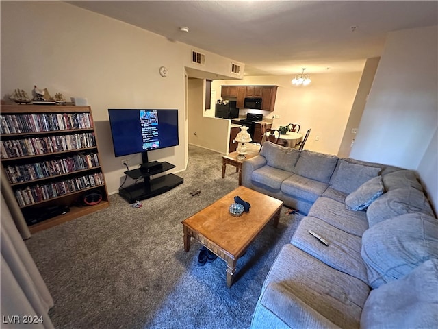 living room featuring an inviting chandelier and carpet