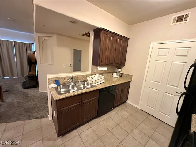 kitchen featuring dark brown cabinets, sink, light tile patterned floors, and dishwasher