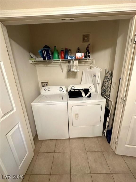 3550 Bay Sands Dr Unit 1085, Laughlin, NV 89029 - laundry area with washer and clothes dryer and light tile patterned flooring