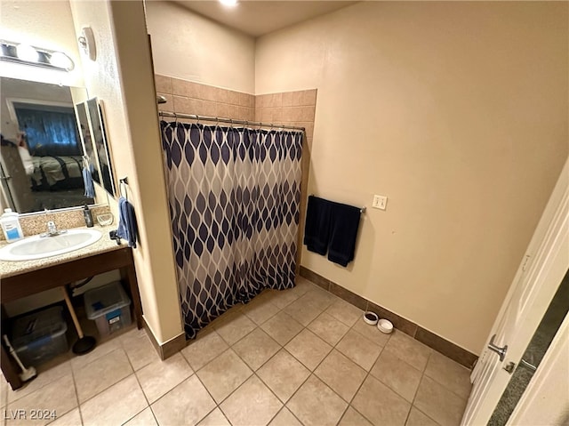 bathroom featuring tile patterned floors, a shower with shower curtain, and vanity