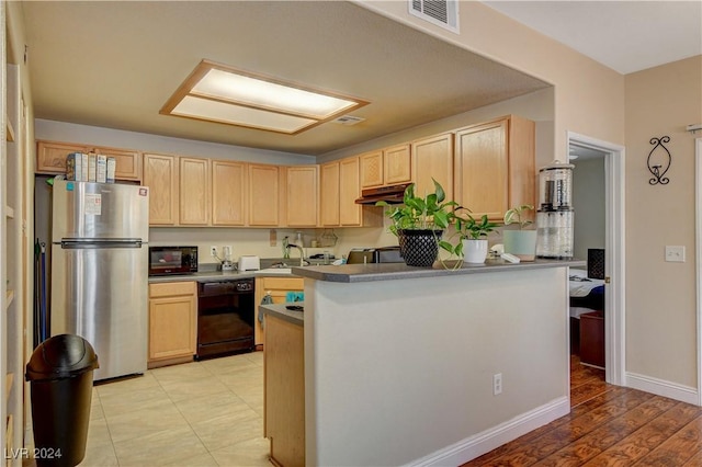 kitchen with sink, kitchen peninsula, black appliances, and light brown cabinets