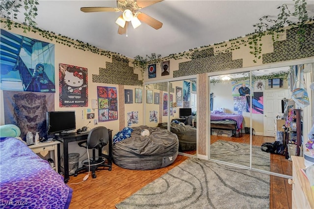 bedroom with ceiling fan and wood-type flooring