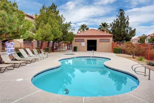 view of swimming pool featuring a patio