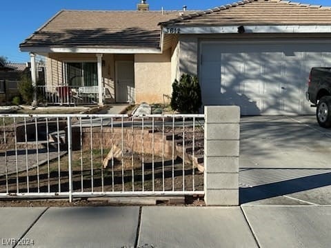 view of front facade featuring covered porch and a garage