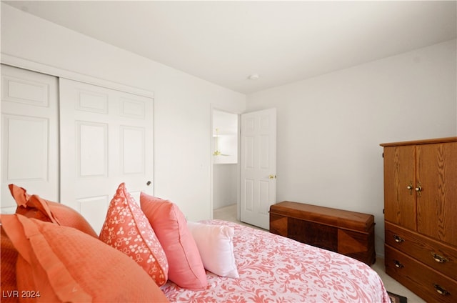 carpeted bedroom featuring a closet