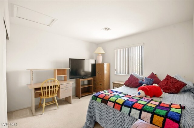 bedroom with light colored carpet