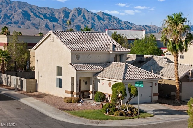 mediterranean / spanish-style house featuring a mountain view