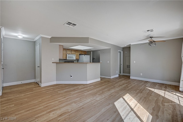 unfurnished living room featuring a ceiling fan, light wood-type flooring, visible vents, and crown molding