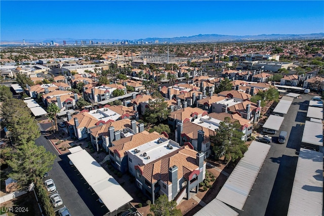 drone / aerial view with a residential view and a mountain view