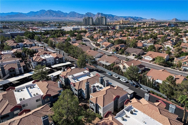 drone / aerial view featuring a residential view and a mountain view