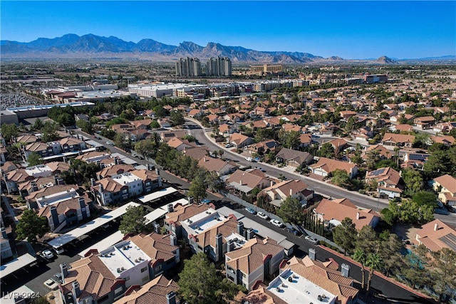 drone / aerial view featuring a residential view and a mountain view