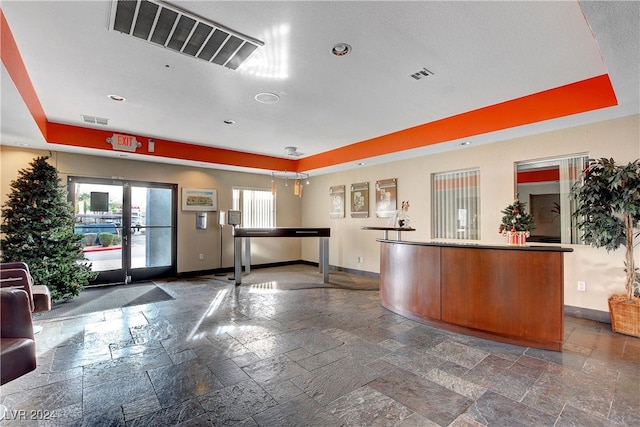 reception area featuring french doors and visible vents