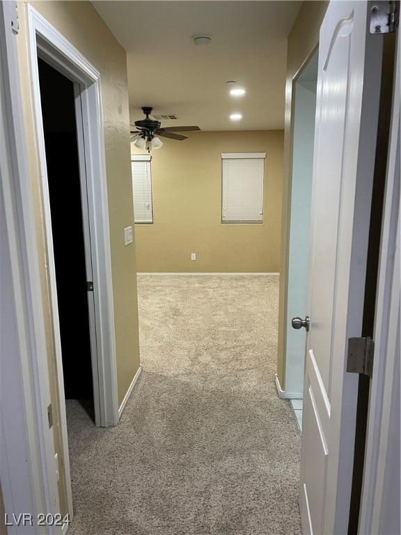 corridor with light colored carpet