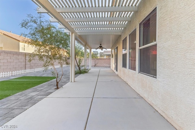 view of patio / terrace featuring ceiling fan and a pergola