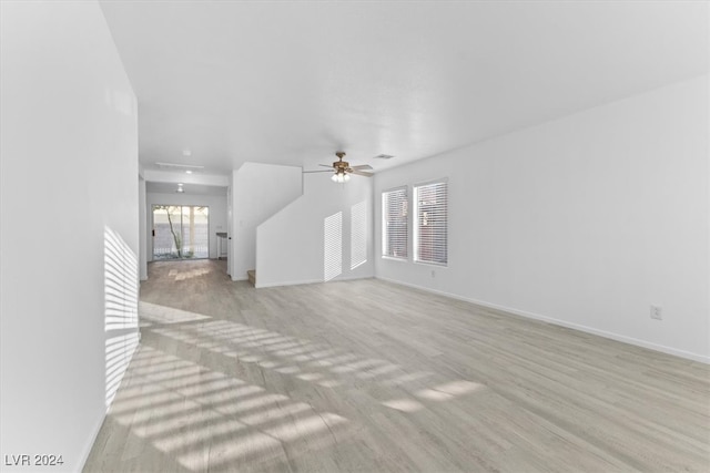 living room featuring light wood-type flooring and ceiling fan