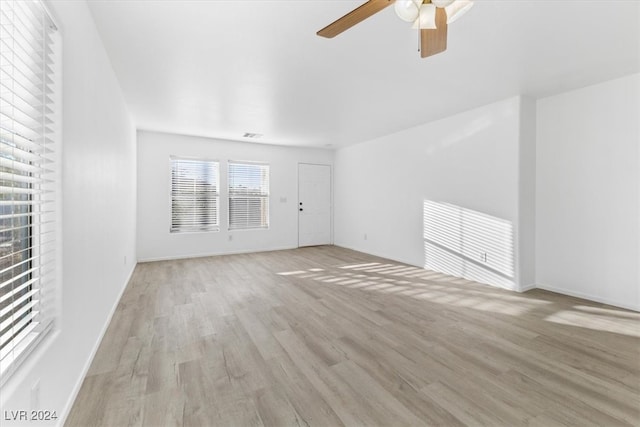 unfurnished living room featuring light wood-type flooring and ceiling fan