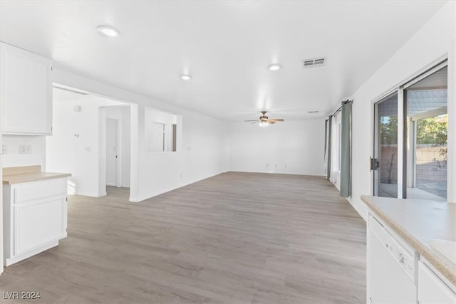 unfurnished living room featuring ceiling fan and light wood-type flooring