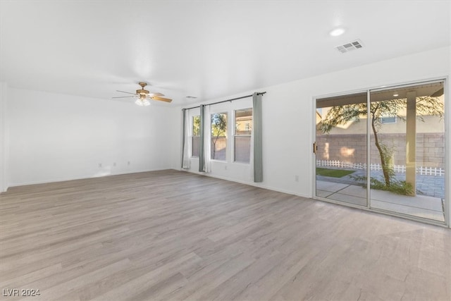 interior space featuring light hardwood / wood-style floors and ceiling fan