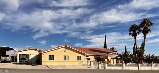 view of front of property with a carport