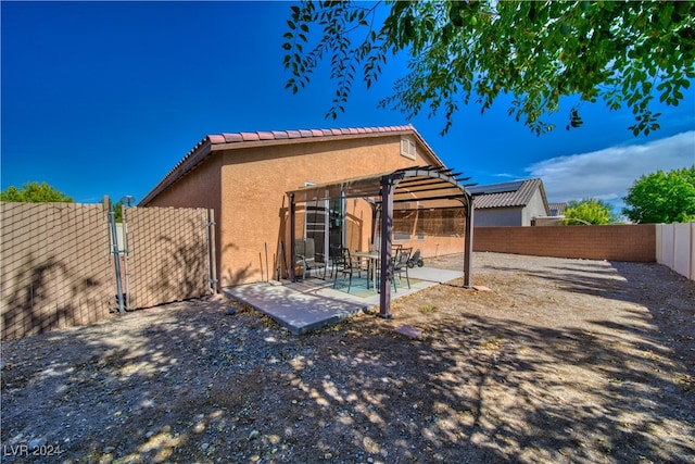 back of house featuring a patio area