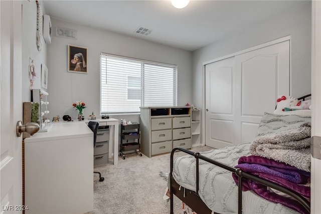 carpeted bedroom with a closet