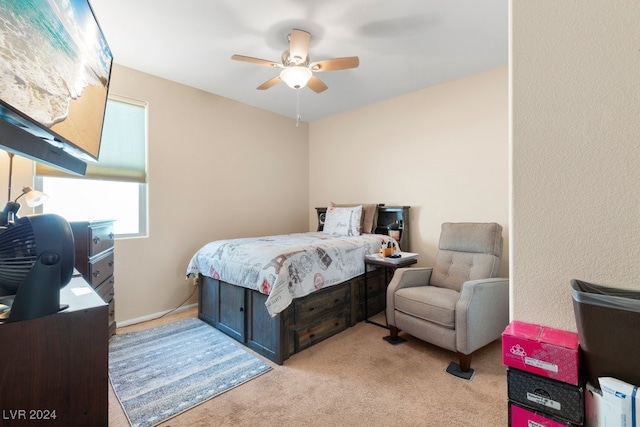 bedroom with light carpet and ceiling fan