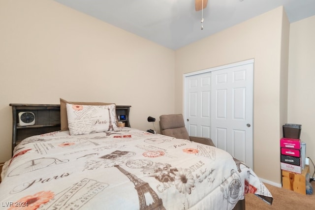 carpeted bedroom with ceiling fan and a closet