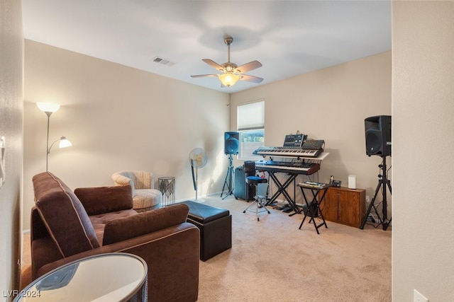 interior space featuring light carpet and ceiling fan