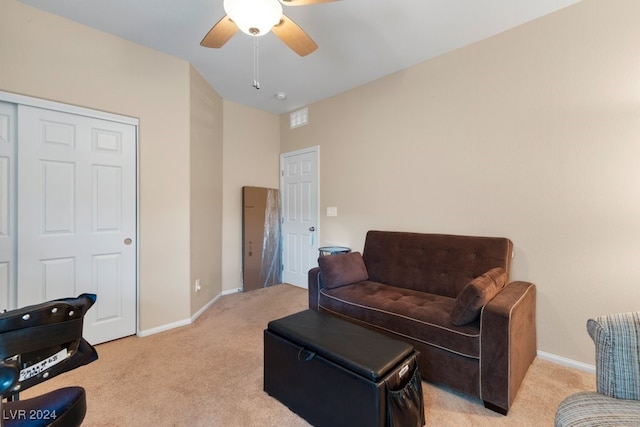 sitting room with light carpet and ceiling fan