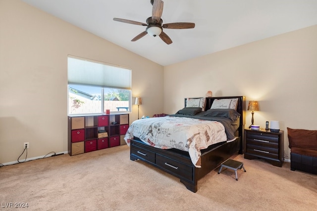 carpeted bedroom with ceiling fan and lofted ceiling