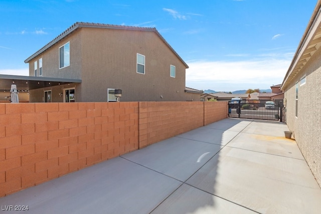 view of side of property featuring a patio