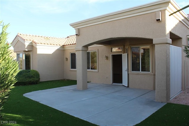 rear view of house featuring a patio area