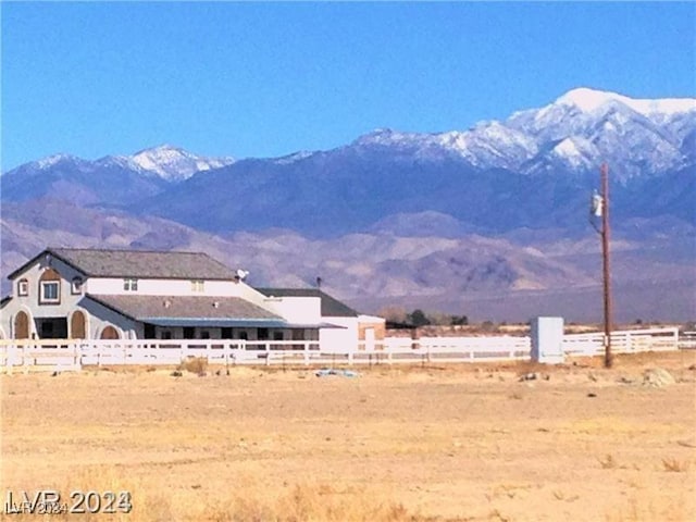 mountain view featuring a rural view