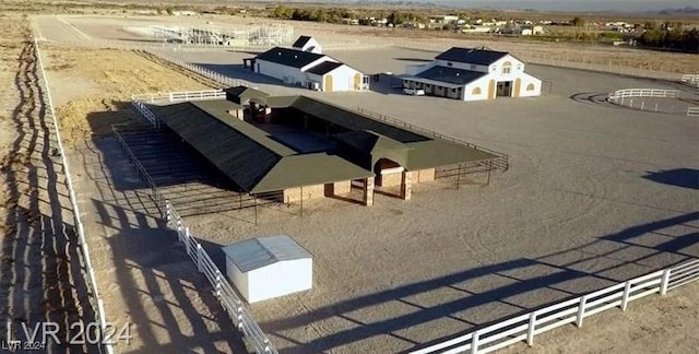 birds eye view of property featuring a rural view