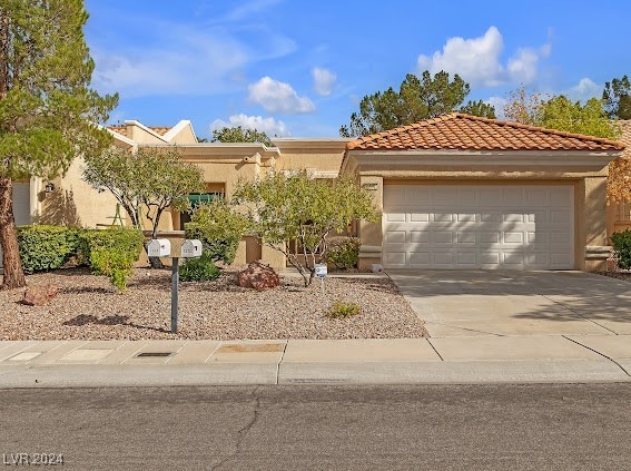 view of front of property with a garage