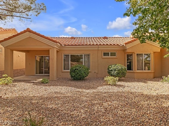 back of property with a patio area