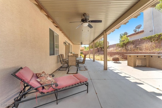 view of patio / terrace with exterior kitchen and ceiling fan