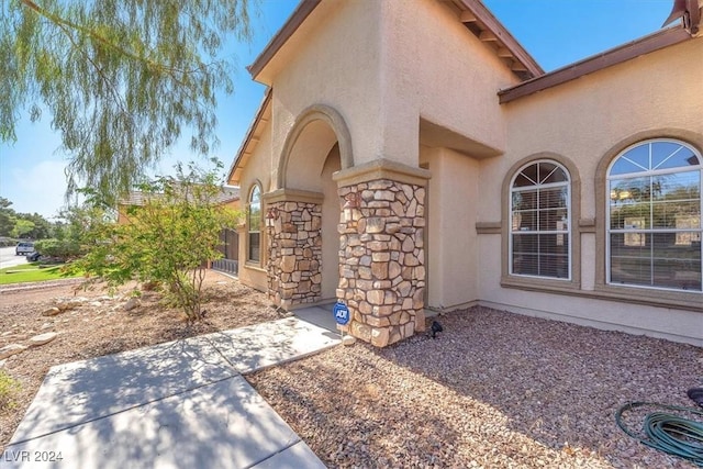 3689 Callahan Ave, Las Vegas, NV 89120 - property entrance featuring stucco siding, stone siding, and a patio