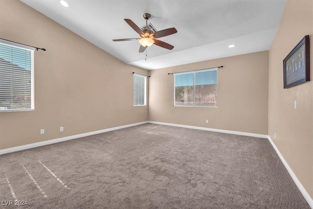 unfurnished room with ceiling fan and carpet flooring