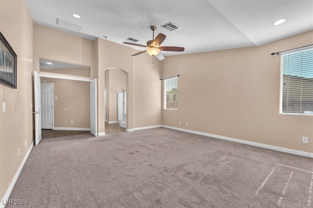 3689 Callahan Ave, Las Vegas, NV 89120 - carpeted spare room featuring arched walkways, a ceiling fan, baseboards, vaulted ceiling, and recessed lighting