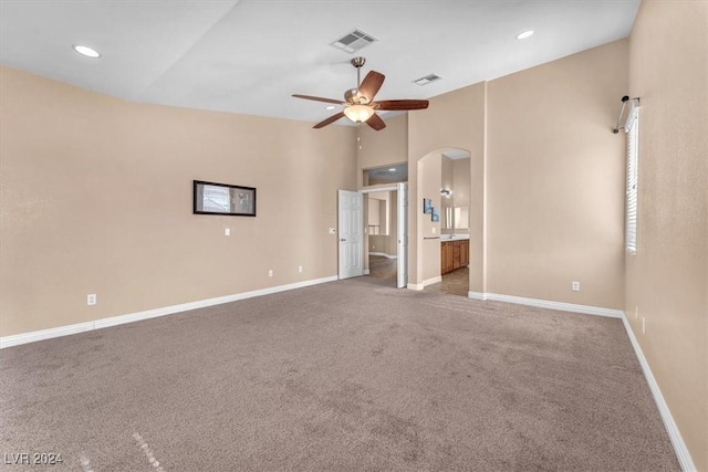 3689 Callahan Ave, Las Vegas, NV 89120 - unfurnished bedroom with arched walkways, carpet floors, lofted ceiling, baseboards, and recessed lighting