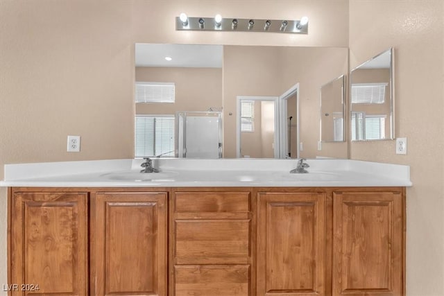 3689 Callahan Ave, Las Vegas, NV 89120 - bathroom featuring double vanity and a shower stall
