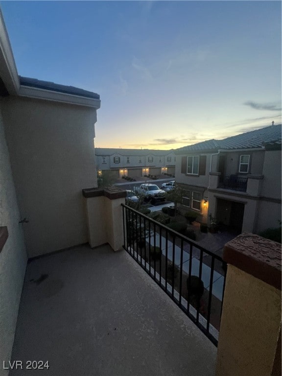 view of balcony at dusk