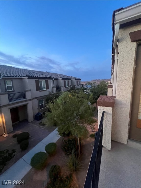 view of balcony at dusk