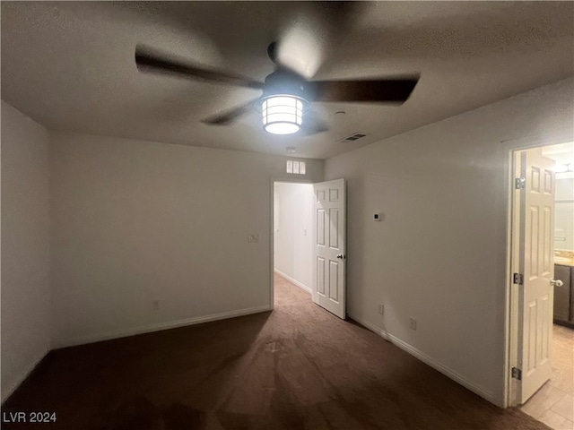 unfurnished room featuring ceiling fan