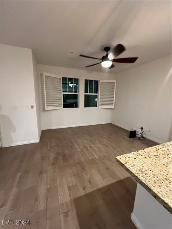 interior space featuring hardwood / wood-style flooring and ceiling fan