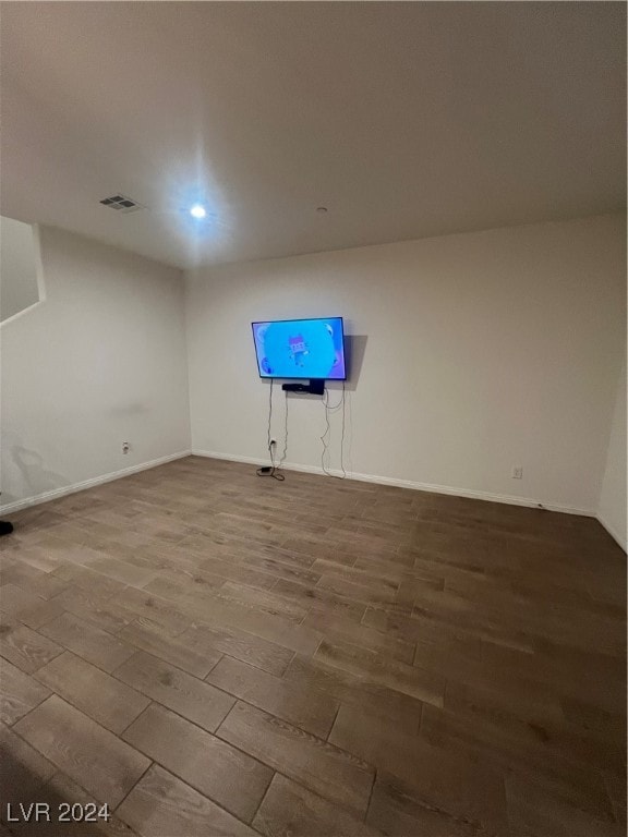 empty room with hardwood / wood-style flooring