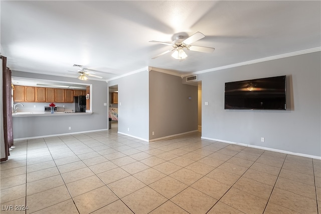 unfurnished living room with crown molding, ceiling fan, and light tile patterned floors